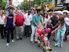 Prime Minister Justin Trudeau marches in the 2016 Pride Parade in Vancouver, BC., July 31, 2016. With him are his wife, Sophie Gregoire Trudeau and Children Xavier, 8, with mayor Gregor Robertson, Ella-Grace, 6, and Hadrien.