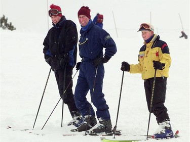 Prince Charles with princes William, left, and Harry take to the slopes of Whistler Mountain during a holiday in 1998.