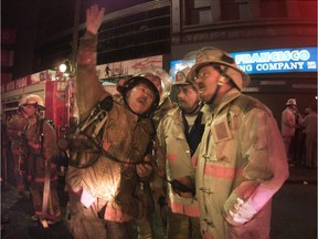 Firefighters attend a blaze that damaged the Chelsea Hotel and adjoining businesses on West Hastings Street in Vancouver's Downtown Eastside in November 2000.