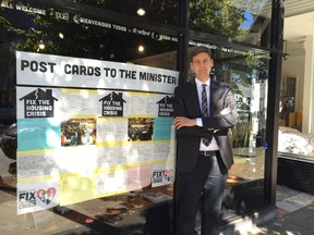 Vancouver-Point Grey MLA David Eby with a window display of comments on the real estate market at his constituency office in Vancouver.