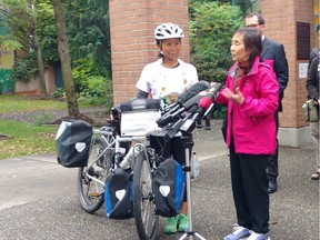 Sept. 5, 2016 - Kidney donor Eileen Zheng (with bike) has completed her amazing cross-country "Gift from Within" tour, cycling from Victoria, B.C. to St. John's, Newfoundland  to support organ donation in Canada.  Zheng donated a kidney to her mom Wei Zhang (in pink coat) last year. Zhang and Zheng are pictured here with MLA Adrian Dix and supporters. Submitted photo.  [PNG Merlin Archive]