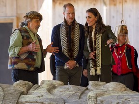 Hereditary Haida Chief and carver Guujaw speaks with Prince William, Duke of Cambridge and Kate, Duchess of Cambridge while touring the carving shed at the Haida Cultural Centre in Skidegate, BC, September, 30, 2016.