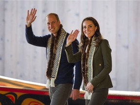 Prince William, Duke of Cambridge and Kate, Duchess of Cambridge wave to well wishers while touring the carving shed at the Haida Cultural Centre in Skidegate, BC, September, 30, 2016.