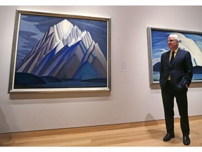Actor Steve Martin stands next to Lawren Harris's Mountain Forms at a preview at the Museum of Fine Arts in Boston, Friday, March 11, 2016.