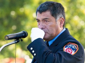 Robert Abril, a Fire Department of New York paramedic, pauses Sunday as he talks about his partner plunging into the World Trade Center on Sept. 11, 2001. His partner never came out. Abril was speaking at a joint memorial event on the U.S.-Canada border at the Peace Arch border crossing.