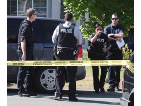 The B.C. government announced Monday it is working on a program to help gangsters escape the criminal lifestyle. Here, the Integrated Homicide Investigation Team (IHIT) investigates a fatal shooting in Surrey on July 24, 2016. (Nick Procaylo/PNG)