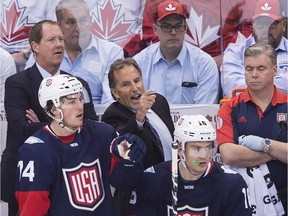 Team USA head coach John Tortorella is all fury as players T.J. Oshie (lower left) and James van Riemsdyk, plus assistant coach Phil Housley (rear left), look on during the team’s 4-2 loss to Canada at the World Cup of Hockey in Toronto on Tuesday. Tortorella is now front and centre on the firing line after the Americans’ quick exit from the tourney.