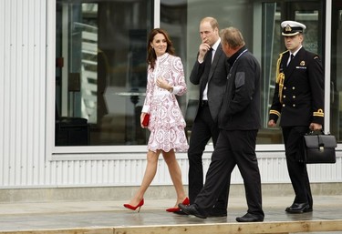 The Duke and Duchess of Cambridge are escorted down to Harbour Air Terminal in Victoria, B.C., Sunday, Sept 25, 2016 where they departed on a float plane on their way to Vancouver for planned events.