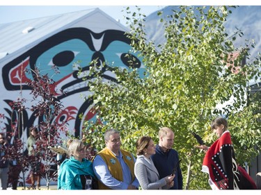 The Duke and Duchess of Cambridge receive a eagle feather from a young girl in Carcross, Yk, Wednesday, Sept 28, 2016.