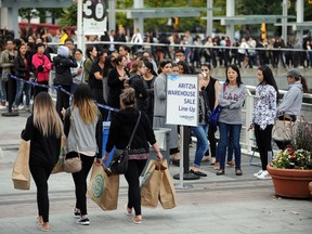 Thousands of shoppers lined up outside Canada Place Thursday morning as early as 5 a.m. for the annual Aritzia warehouse sale.
