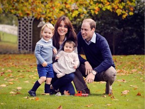 A handout picture obtained in London on December 18, 2015, shows Britain's Prince William (R), Catherine, Duchess of Cambridge (2nd L) and their two children Prince George (L) and Princess Charlotte in a photograph taken in late October 2015 at Kensington Palace in London.