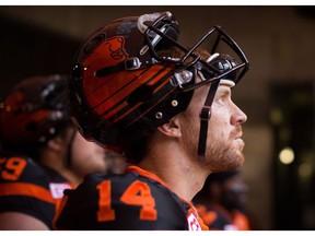 B.C. Lions' quarterback Travis Lulay waits during introductions before a CFL football game against the Calgary Stampeders in Vancouver, B.C., on Saturday June 25, 2016.