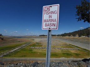 Sign of the times: Boat docks sit empty on dry land last year, on Folsom Lake reservoir near Sacramento, Calif. Far away in the distance you can see water.