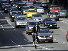 A cyclist rides along the bike lane