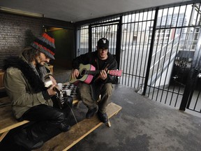 Residents of the Bosman Hotel in Vancouver play music in a breezeway through the building.