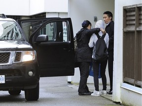 Richmond RCMP investigate a homicide at an apartment in the 7000 -block Granville Avenue on May 4, 2014.  James Jian Hua Wu has pleaded not guilty to the second-degree murder of his spouse, Jin Jenna Cheng.