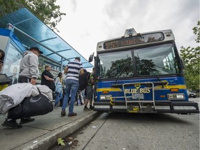 A Blue Bus picks up passengers outside Park Royal shopping centre in West Vancouver, September 1, 2016.
