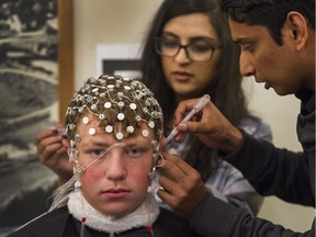 Richmond FC goalkeeper Blake Charlesworth, 14, tests EEGlewave's concussion-screening system at Brighouse Park in Richmond.