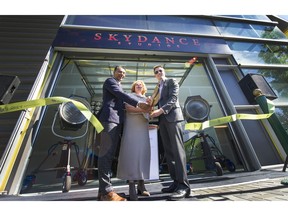 Left to Right: MLA Amrik Virk, Surrey mayor Linda Hepner and Skydance Media CEO David Ellison cut the ribbon at the new Skydance Studios in Surrey, BC., September 20, 2016.  opening of the former Pacific Press Newspaper Plant now converted into the studio which will be the production home of the Netflix science fiction series Altered Carbon.