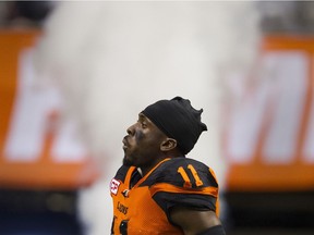 Mike Edem runs on to the field for the start of the Leos' game in July vs. the Argos at BC Place.