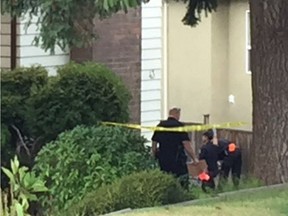 Vancouver police detectives on Dieppe Place in east Vancouver on Sept. 18, 2016. Two bodies and evidence of a kidnapping were found at the scene.