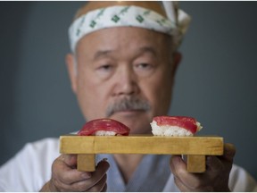 Hidekazu Tojo shows off his red tuna nigiri sushi, on the left, and another restaurant's portion.