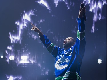 Drake performs on stage in a Vancouver Canucks jersey at Rogers Arena, Vancouver, September 17, 2016.