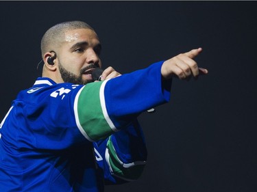 Drake performs on stage in a Vancouver Canucks jersey at Rogers Arena, Vancouver, September 17, 2016.