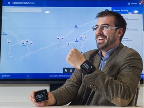 Gonzalo Tudela shows off the wearable devices used to help improve safety in productivity in mines.
