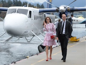 The Duke and Duchess of Cambridge arrive on a float plane in Vancouver, B.C., Sunday, Sept. 25, 2016. Prince William and his wife Kate will be surrounded by British Columbia's natural beauty and experience indigenous culture on Monday with a trip to pristine rainforest in the Central Coast region.