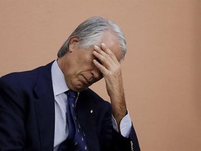Italian Olympic Committee President Giovanni Malago&#039; touches his forehead during a press conference in Rome, Tuesday, Oct. 11, 2016. The Italian Olympic Committee is suspending Rome&#039;s bid for the 2024 Games for the time being, while leaving open the possibility for a revival of the candidacy if there is a change in city government. (AP Photo/Alessandra Tarantino)