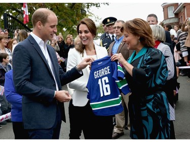 Catherine, Duchess of Cambridge and Prince William Duke of Cambridge is presented with personalised sports shirts for Prince George and Princess Charlotte by B.C. Premier Christy Clark at Cridge Centre for the Family on the final day of their Royal Tour of Canada on October 1, 2016 in Victoria, Canada. The Royal couple along with their Children Prince George of Cambridge and Princess Charlotte are visiting Canada as part of an eight day visit to the country taking in areas such as Bella Bella, Whitehorse and Kelowna