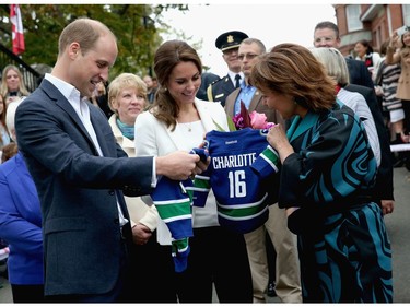 Catherine, Duchess of Cambridge and Prince William Duke of Cambridge is presented with personalised sports shirts for Prince George and Princess Charlotte by B.C. Premier Christy Clark at Cridge Centre for the Family on the final day of their Royal Tour of Canada on October 1, 2016 in Victoria, Canada. The Royal couple along with their Children Prince George of Cambridge and Princess Charlotte are visiting Canada as part of an eight day visit to the country taking in areas such as Bella Bella, Whitehorse and Kelowna