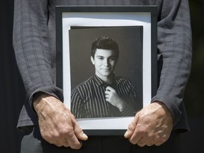A portrait of Luka Gordic is held at B.C. Provincial Court in North Vancouver in 2015, at the bail hearing for three men charged with his murder.