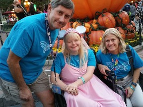 Angel Magnussen, 20 (middle), is flanked by her dad Arnie Magnussen (left) and her aunt Sheila Rindall at Disneyland in Anaheim, Calif. on Oct. 7, 2016. Angel was given a trip to the theme park after Surespan Construction Ltd. read about her story in The Province back in May 2016.