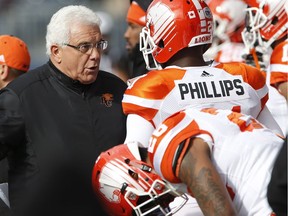 B.C. Lions head coach Wally Buono talks to Ryan Phillips (21) during the first half of CFL action against the Winnipeg Blue Bombers in Winnipeg Saturday, October 8, 2016.