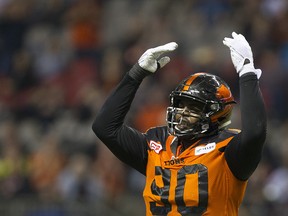 B.C. Lions #90 Mic’hael Brooks gestures for the fans to make more noise as the Lions defend against the Edmonton Eskimos in a regular season CFL football game at BC Place.