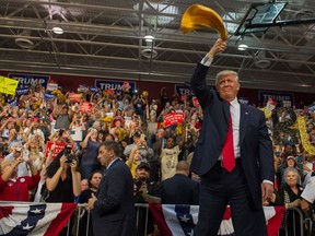 President-elect Donald Trump waves a towel to supporters during an election-campaign rally at Ambridge Area Senior High School on Oct. 10, 2016 in Ambridge, Pennsylvania. The town, home to a fabricating plant that once employed 60,000 workers, has many resident concerned about lost jobs that have had devastating economic effects on their community.