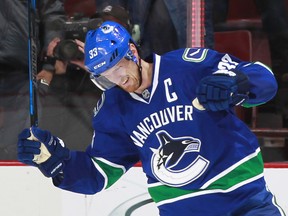 Henrik Sedin of the Canucks celebrates the overtime winning goal against the St. Louis Blues during their NHL game at Rogers Arena October 18, 2016 in Vancouver, British Columbia, Canada. Vancouver won 2-1 in overtime.