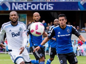Vancouver Whitecaps defender Kendall Waston (4), San Jose Earthquakes defender Victor Bernardez (5), and midfielder Darwin Ceren (17) chase the ball in the first half at Avaya Stadium.