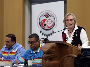 Assembly of First Nations National Chief Perry Bellegarde (seated far left) and Inidigenous and Northern Affairs Minister Carolyn Bennett (at the podium), shown earlier this week at the Assembly of First Nations' annual general meeting in Victoria, don’t see eye to eye on whether they’re ‘engaging’ in discussions to replace the controversial First Nations transparency law enacted by the previous Conservative government.