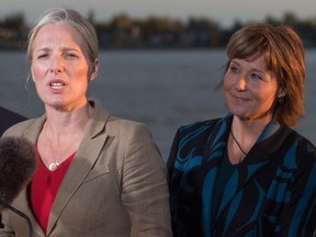 B.C. Premier Christy Clark listens while federal Environment Minister Catherine McKenna answers a reporter’s question last month in Richmond, where the feds announced they would be approving Pacific NorthWest LNG’s $11.4-billion project.