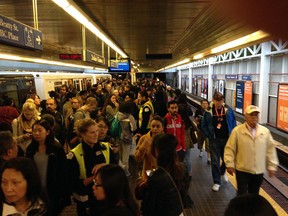 Commuters line up at Stadium Station after a medical emergency caused Main Street station to be shutdown.