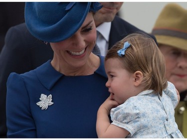 The Duchess of Cambridge holds her daughter Princess Charlotte as the family arrives in Victoria, B.C., on Saturday, September 24, 2016.