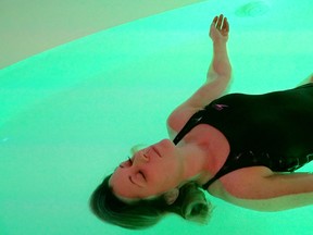 Michele demonstrates floating in Halsa’s Genesis Pod filled with 10” of water and 1000 lbs of Epson salt.