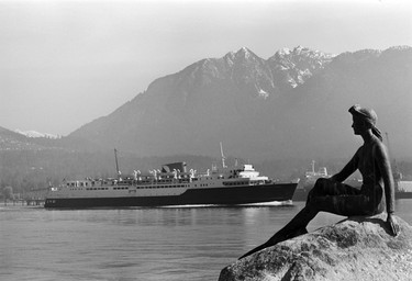 Elek Imredy’s Girl in a Wetsuit sculpture at Stanley Park and the CN ferry passing Brockton Point. February 5, 1973.