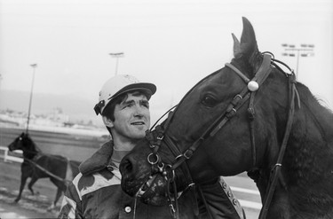 Vancouver Canucks player Pat Quinn with harness horse at Exhibition Park racecourse. August 25, 1970.