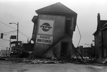 Demolition of Eddie’s Confectionary store and building at Robson and Hamilton. December 3, 1976.