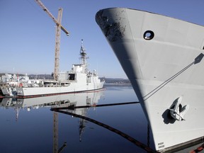 Warships sit at dock at CFB Esquimalt in a file photo. Dredging at the waterfront has brought up several historical items that were likely dropped by accident into the harbour.