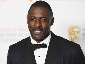 Idris Elba has a lot to smile about.